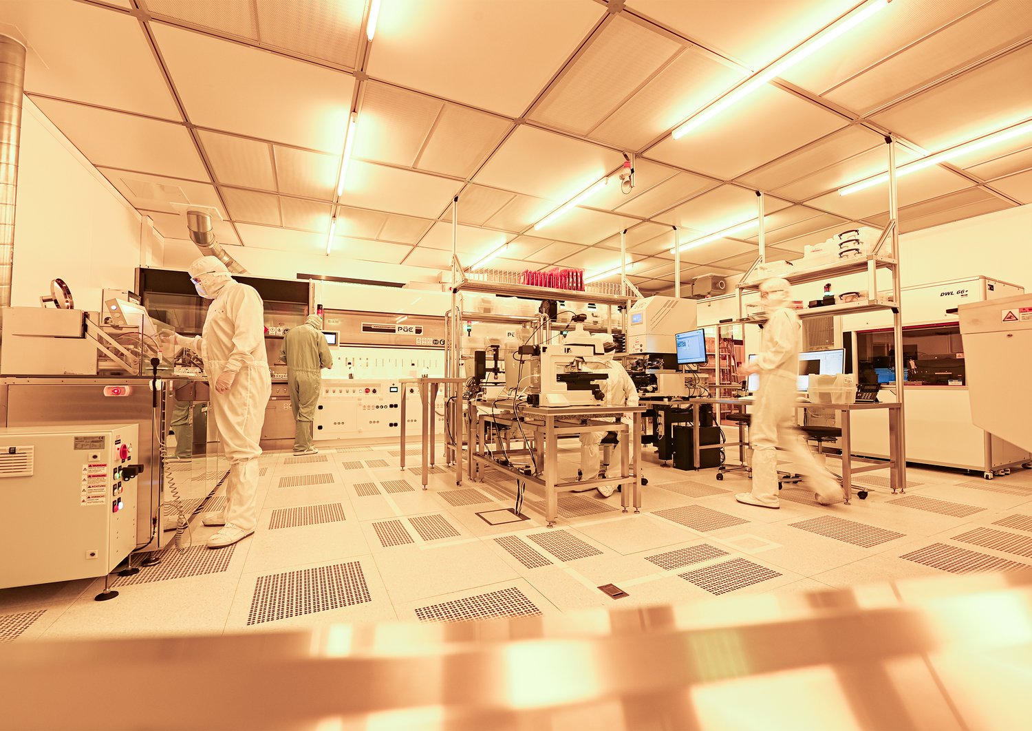 Researchers working in a cleanroom